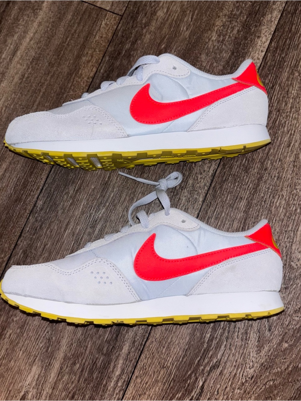 Nike Kids White Sneakers with Neon Pink Swoosh and Yellow Outsole